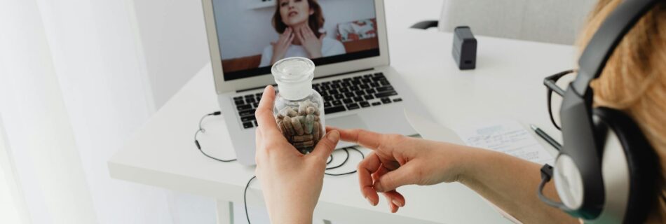 A medical professional consulting a patient online via video call for remote healthcare services.